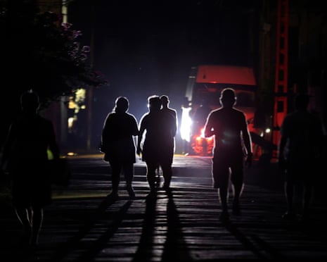 People walk down a street during a power outage in Havana, Cuba, 25 May 2026.