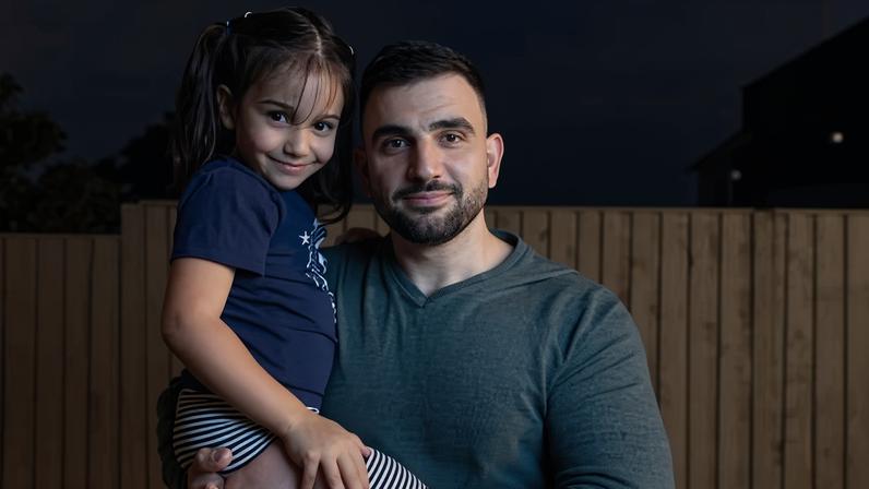 Ali Hamka and his daughter Akiya at home in Kingsgrove, Sydney. Their family’s ancestral home in southern Lebanon has been destroyed in bombing by Israeli forces.