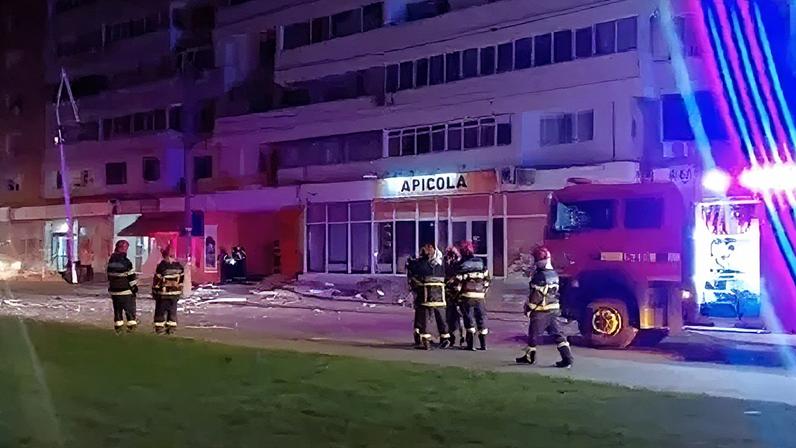 Emergency services work at the scene of a drone crash in Romania