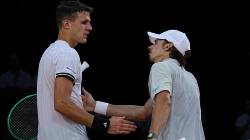 Australia's Alex de Minaur congratulates Jakub Mensik after their match in Paris.