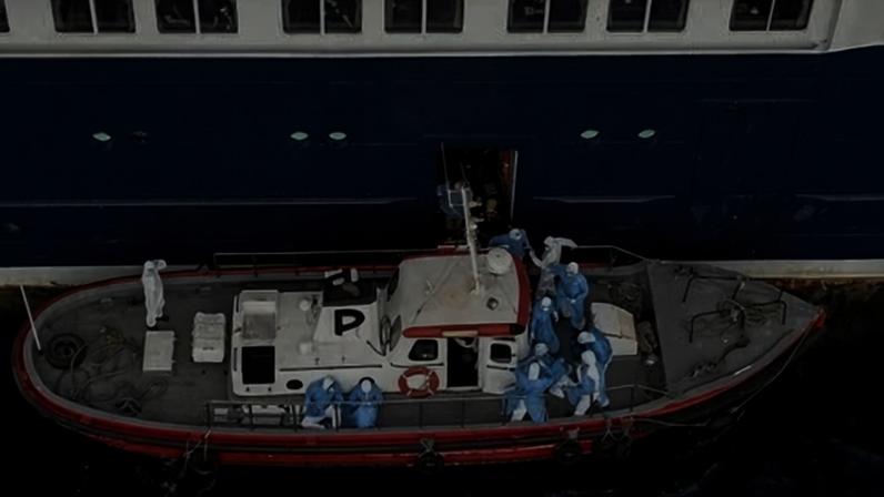 Health workers assist patients onto a boat from MV Hondius, off the port of Praia, the capital of Cape Verde, on 6 May 2026.