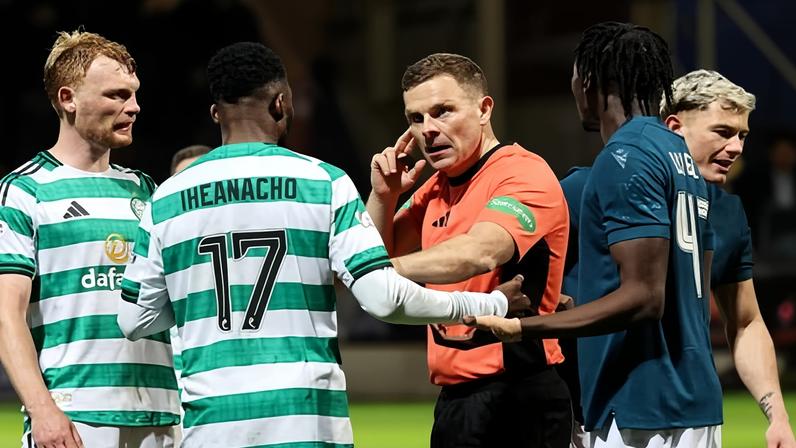 John Beaton speaks to Kelechi Iheanacho while also communicating with the video assistant referee officials during the Scottish Premiership match between Motherwell and Celtic