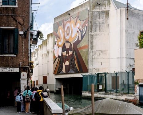 A Derrick Adams mural opposite the entrance to the Arsenale in tribute to Koyo Kouoh, the event’s curator, who died last year.