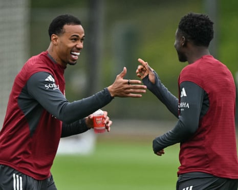 Gabriel and Bukayo Saka share a joke in training as Arsenal prepare for their trip to West Ham.