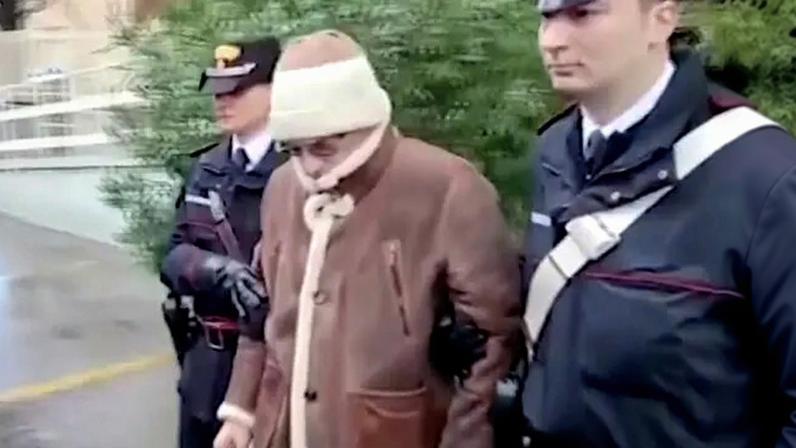 Matteo Messina Denaro being led from a police station after his arrest in Palermo in 2023.
