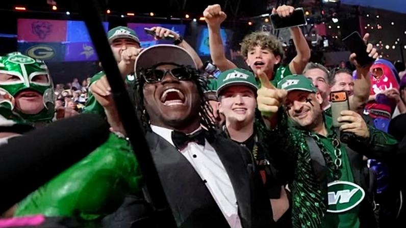 David Bailey poses with New York Jets fans after being drafted as second overall pick.
