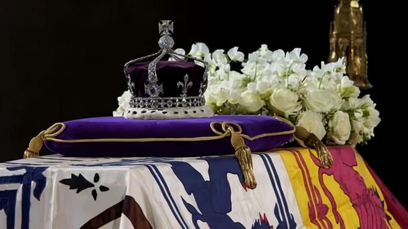 The queen mother's coronation crown bearing the Koh-i-noor diamond sits on top of her coffin after her death in 2002.