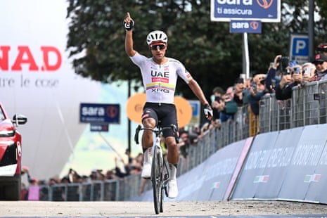 Jhonatan Narváez of UAE Team Emirates XRG raises a finger to the sky as he crosses the finish line in Fermo.