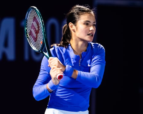 Emma Raducanu lifts her tennis racket