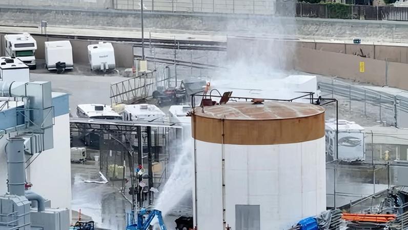 Water sprayed on chemical tank