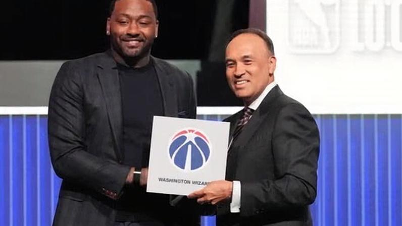 Washington’s former No 1 pick John Wall poses with NBA deputy commissioner Mark Tatum after the Wizards won Sunday’s lottery.