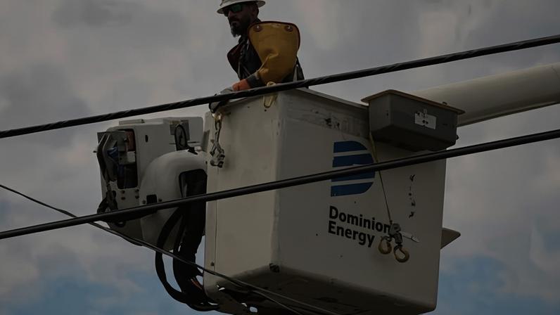 A Dominion Energy lineman lifts himself up to work on a power line in the aftermath of Hurricane Helene on 29 September 2024, in North Augusta, South Carolina.