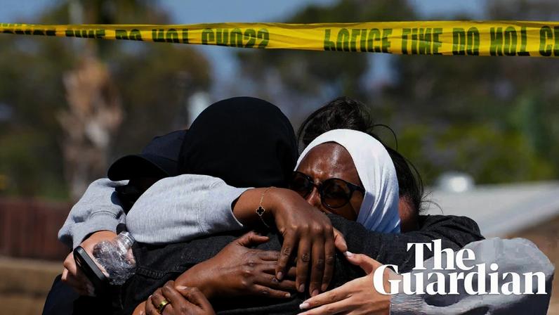 Mourners embrace one another near the Islamic Center of San Diego on 19 May 2026, a day after the deadly shooting.