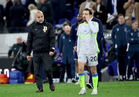 Pep Guardiola walks off the pitch after a night when his team dropped two points in the title race.