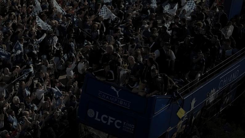 Leicester celebrate with the trophy during the open-top bus parade through the city centre after they won the 2016 Premier League.