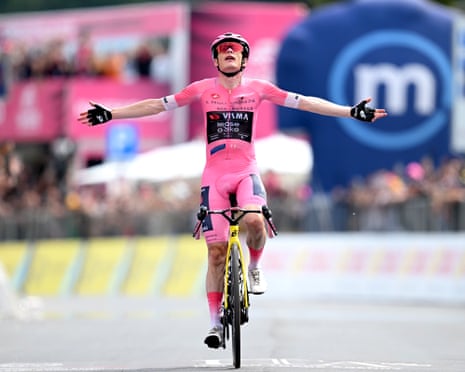 Jonas Vingegaard spreads his arms wide after pulling away from his rivals on the punishing final climb to win the Giro’s penulitimate stage