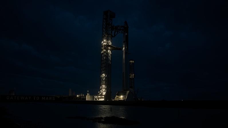 Under stormy skies at dawn, the SpaceX Super Heavy Booster and Starship spacecraft stand on Orbital Launch Pad 2 at Starbase, Texas, on 21 May.