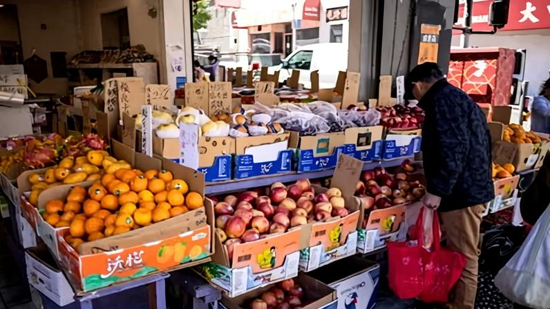 Shoppers browse fruit at a store in the Chinatown district of San Francisco, California, on 13 May 2026.