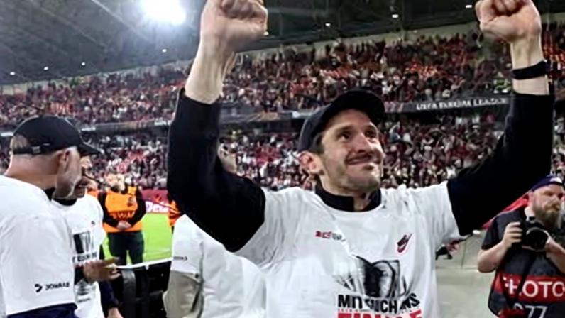 Julian Schuster celebrates after Freiburg reach the Europa League final.