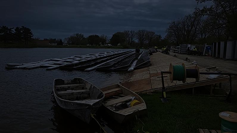 Engineers and construction workers work on a floating solar project at Twin Lake Reservoir in Lima, Ohio.