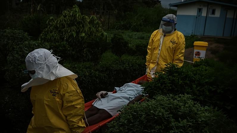 Medical staff carry an Ebola patient to a treatment centre in Rwampara, Congo, 21 May. There have been 177 suspected deaths from the disease so far.