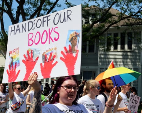 ‘They’re trying to narrow the worldview of young people today’ … a pride parade with marchers protesting about banned books.