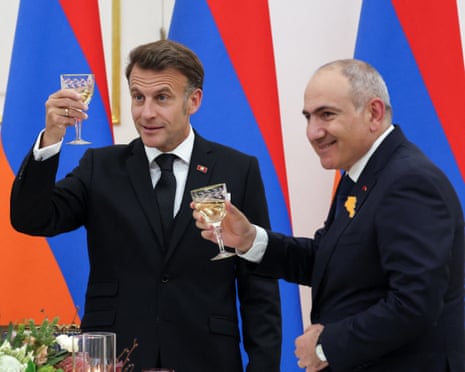 Emmanuel Macron shares a toast with Armenia's prime minister, Nikol Pashinyan, at a state dinner in the honour of the French president in Yerevan.