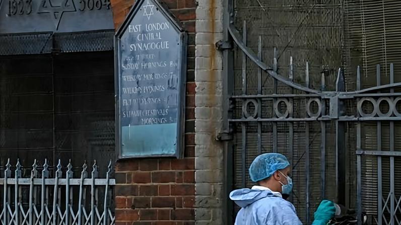 A police forensics officer works at the scene outside the former East London Central Synagogue in Whitechapel on Tuesday.