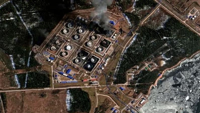 A satellite near-infrared image shows smoke rising from damaged oil storage tanks after a Ukrainian attack in Primorsk, Russia, in March.
