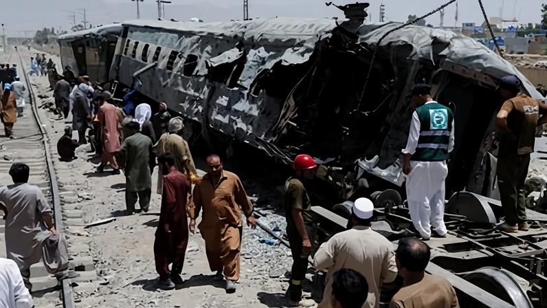 Railway staff working at the site of the blast on Sunday.