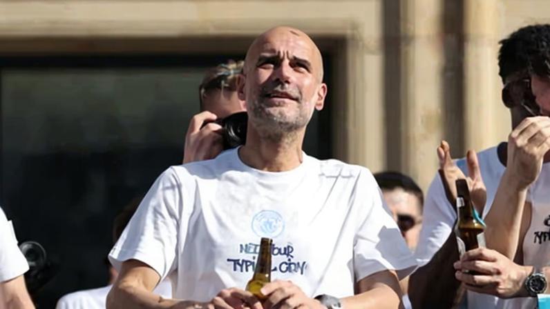 Pep Guardiola during Manchester City’s open-top bus parade.