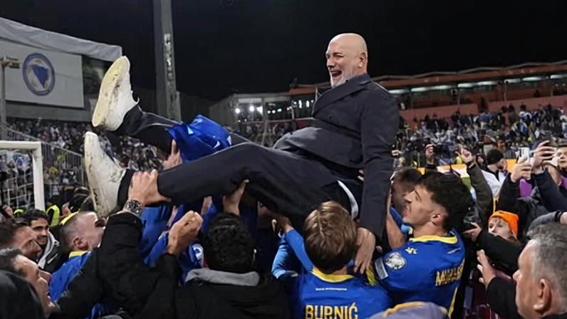 Bosnia and Herzegovina coach Sergej Barbarez is hoisted in to the air by his players