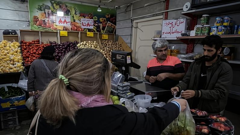 Women shop for fruit and vegetables on 26 March 2026 in Tehran, Iran, where vegetable prices have increased by 308% in a year.