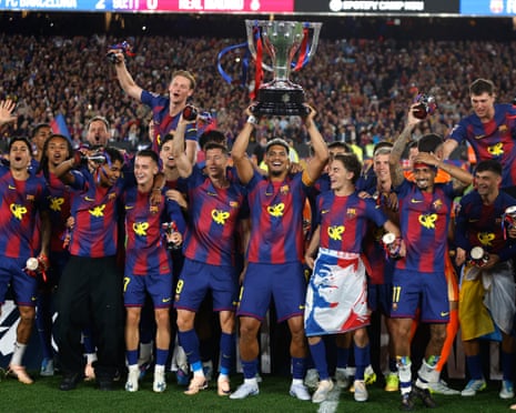 Barcelona’s Ronald Araújo lifts the La Liga trophy after the 2-0 win over Real Madrid.