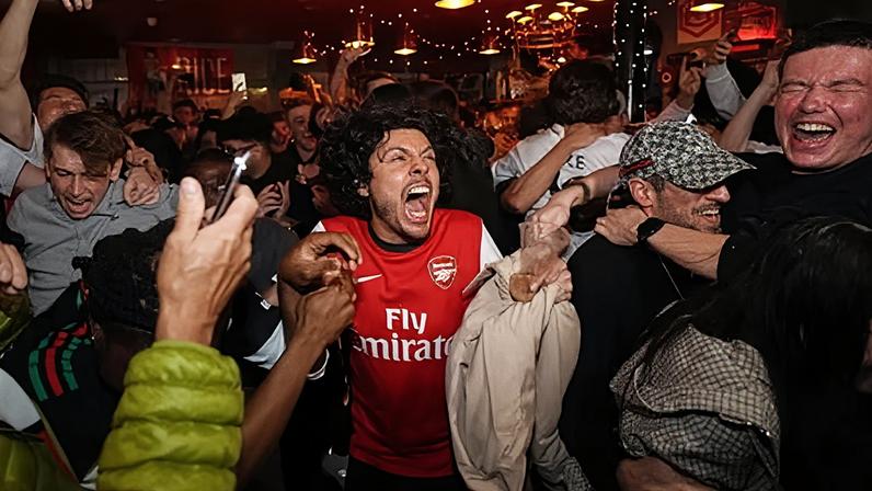 Arsenal players, including Bukayo Saka, celebrate winning the Premier League