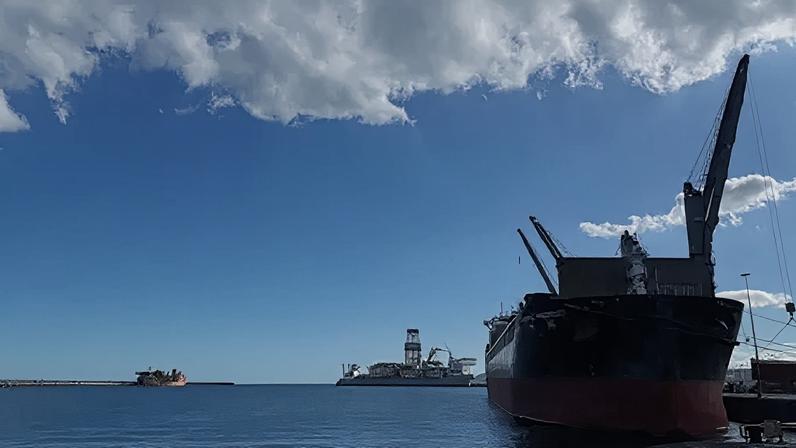 A cargo ship sits in the industrial port of Granadilla, Tenerife