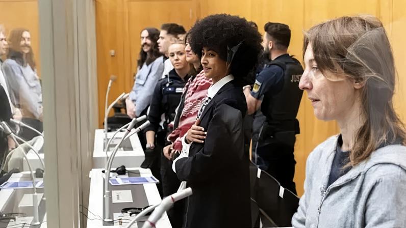Hannah "Zo" Hailu (C) is one of the two British citizens on trial in Germany