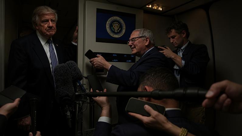 Donald Trump speaks to the media aboard Air Force One on 15 May 2026 as he returns to the United States.