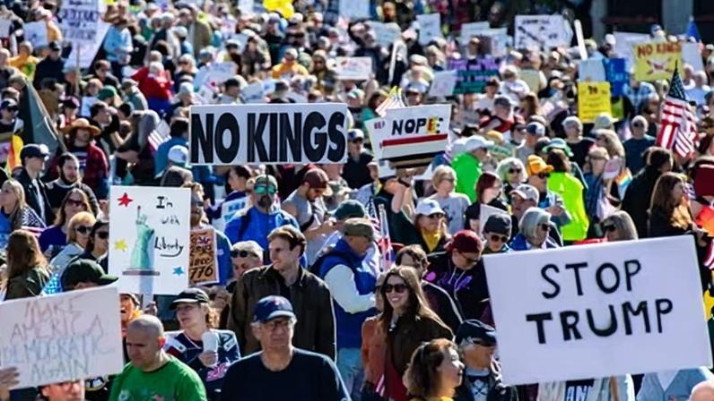 People participate in the No Kings national day of protest in Boston, Massachusetts, on 18 October 2025.