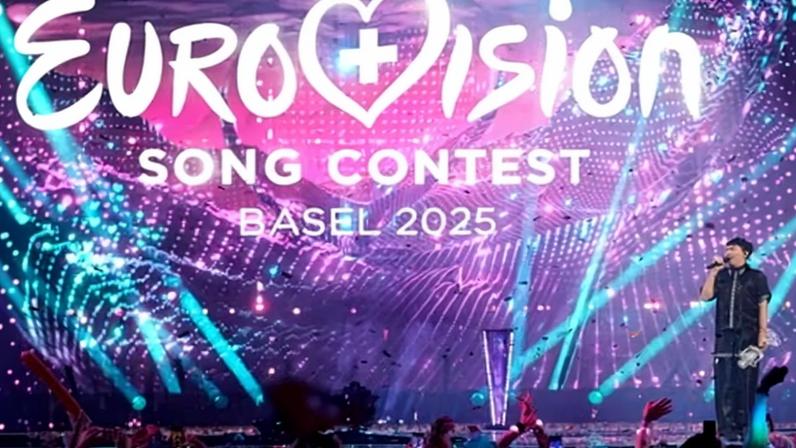 Last year’s Eurovision winner, Austria’s JJ, on stage with the trophy in Switzerland in May 2025.