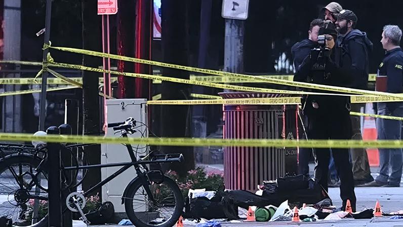 Getty Images A forensic investigator takes photos behind a police tape blocking off a crime scene with evidence markers seen on a sidewalk on 17th and Pennsylvania Ave near the White House in Washington