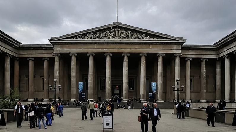 Reuters Groups of people stand outside the entrance of the British Museum in London.