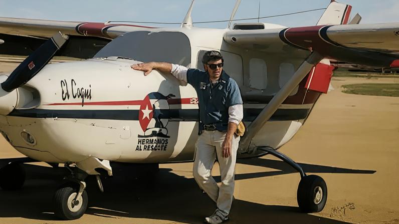 Carlos Costa beside a plane