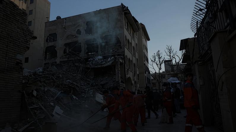 Iranian workers clean around a destroyed Khorasaniha synagogue in Tehran, Iran, on 7 April 2026.