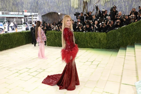 Event chair Nicole Kidman, who has been on a Chanel contract for more than 20 years, wears a sequinned blood red gown with a puffs of feathers on its peplum and cuffs. Photograph: Michael Loccisano/GA/The Hollywood Reporter/Getty Images
