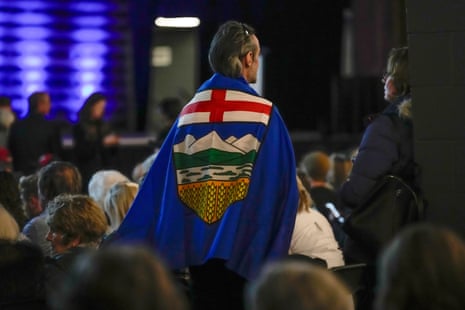An attendee wears an Alberta flag during the Alberta independence town hall in Canada’s Calgary on 26 January 2026.