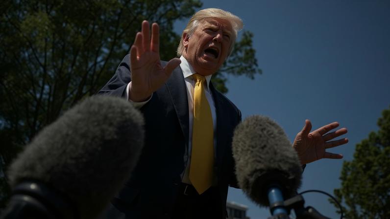 Donald Trump speaks to the press before walking to board Marine One.