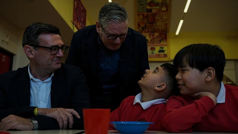 Keir Starmer and Andy Burnham meet children at a primary school in Ashton-under-Lyne, Greater Manchester, 13 April 2026.