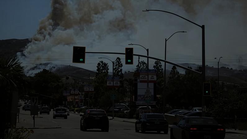 Smoke from the fire billows over Simi Valley in southern California on Monday.