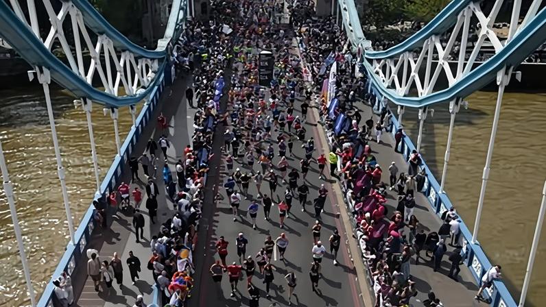 Runners cross Tower Bridge during the 2026 London Marathon.